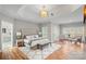 Spacious main bedroom with a tray ceiling, sitting area, and ensuite bathroom at 888 Craigmont Nw Ln, Concord, NC 28027
