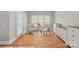 Bright sitting area with hardwood floors, neutral-toned furniture, and ample natural light at 888 Craigmont Nw Ln, Concord, NC 28027
