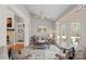 Cozy sunroom with brick floors, comfortable seating, and access to the outdoors at 888 Craigmont Nw Ln, Concord, NC 28027