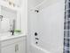 Bathroom with white subway tiles, shower and tub with modern black hardware at 1010 Rolling Meadows Dr # Rm14, Mooresville, NC 28115