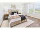 Inviting bedroom showcasing a cozy bed, modern bedside tables, elegant lamps, and a neutral color palette at 1010 Rolling Meadows Dr # Rm14, Mooresville, NC 28115