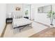 Serene bedroom featuring a plush bed, stylish decor, and large window that provides ample natural light at 1010 Rolling Meadows Dr # Rm14, Mooresville, NC 28115