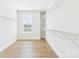 Walk-in closet with ample shelving and natural light at 1010 Rolling Meadows Dr # Rm14, Mooresville, NC 28115