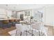Open dining area with modern table and chairs, next to kitchen with a large sliding glass door at 1010 Rolling Meadows Dr # Rm14, Mooresville, NC 28115