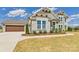 Beautiful home with stone accents, green siding, and a three car garage at 1010 Rolling Meadows Dr # Rm14, Mooresville, NC 28115