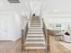 View of the staircase with wooden handrail and hardwood flooring in a modern home at 1010 Rolling Meadows Dr # Rm14, Mooresville, NC 28115