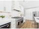 Stylish kitchen with stainless steel range, white cabinetry, and modern appliances at 1010 Rolling Meadows Dr # Rm14, Mooresville, NC 28115