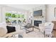 Bright living room with stone fireplace and sliding glass doors to the patio at 1010 Rolling Meadows Dr # Rm14, Mooresville, NC 28115
