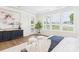 Sun-filled main bedroom boasting tray ceiling, hardwood floors, large windows, and designer decor, creating a serene retreat at 1010 Rolling Meadows Dr # Rm14, Mooresville, NC 28115