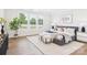 Spacious main bedroom featuring tray ceiling, large windows, hardwood floors, and ample natural light with stylish decor at 1010 Rolling Meadows Dr # Rm14, Mooresville, NC 28115