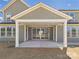 Covered patio with white posts and gray siding at 1010 Rolling Meadows Dr # Rm14, Mooresville, NC 28115