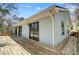 Exterior view of the house with a wooden deck, siding, and sliding glass doors for backyard access at 1205 Molokai Dr, Tega Cay, SC 29708