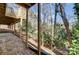 View of the backyard landscaping and mature trees from underneath the deck at 1205 Molokai Dr, Tega Cay, SC 29708
