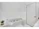 Bright bathroom featuring a jacuzzi tub and ample space at 1205 Molokai Dr, Tega Cay, SC 29708