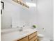 Well-lit bathroom with a single sink vanity and a large mirror at 1205 Molokai Dr, Tega Cay, SC 29708