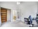 Bright bedroom featuring closet, bathroom entrance, desk and neutral decor at 1205 Molokai Dr, Tega Cay, SC 29708