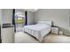 Bright bedroom featuring a large window, a comfortable bed, and neutral decor at 1205 Molokai Dr, Tega Cay, SC 29708