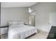 Neutral bedroom with a ceiling fan and a comfortable bed, showcasing simplicity at 1205 Molokai Dr, Tega Cay, SC 29708