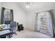 Bright bedroom featuring two windows, desk and neutral decor at 1205 Molokai Dr, Tega Cay, SC 29708