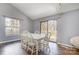 Bright dining room with a large window and sliding glass door to the outside deck at 1205 Molokai Dr, Tega Cay, SC 29708