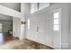 Bright foyer featuring a double front door, tile flooring, and natural light from above at 1205 Molokai Dr, Tega Cay, SC 29708