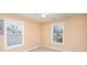 Bright bedroom with neutral tones and natural light from two windows at 124 Woodside Ln, Lancaster, SC 29720