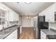 Contemporary kitchen featuring stainless appliances, stylish countertops, and bright lighting at 124 Woodside Ln, Lancaster, SC 29720