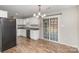 Open-concept kitchen with stainless steel appliances, a view to the outdoors, and access to the patio at 124 Woodside Ln, Lancaster, SC 29720