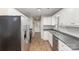 Modern kitchen with stainless steel appliances, sleek countertops, and convenient breakfast bar seating at 124 Woodside Ln, Lancaster, SC 29720