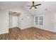 Bright living room with hardwood floors, ceiling fan, and natural light at 124 Woodside Ln, Lancaster, SC 29720