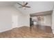 Open living room with hardwood floors that connects to the kitchen, and a vaulted ceiling at 124 Woodside Ln, Lancaster, SC 29720