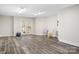 Finished basement features walkout access and durable wood-look vinyl plank flooring at 126 Emerald Dr, Mooresville, NC 28117