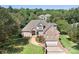 Beautiful brick home with lush landscaping, a paved driveway, and attached two-car garage at 126 Emerald Dr, Mooresville, NC 28117