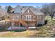 Beautiful brick home with a spacious deck and covered patio at 126 Emerald Dr, Mooresville, NC 28117