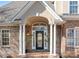 Elegant front entrance features beautiful columns and a glass-paneled front door at 126 Emerald Dr, Mooresville, NC 28117