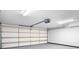 Spacious garage featuring a modern garage door opener and ample overhead lighting at 126 Emerald Dr, Mooresville, NC 28117