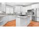 Well-lit kitchen with granite countertops, stainless steel appliances and a center island at 126 Emerald Dr, Mooresville, NC 28117
