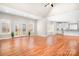 Open-concept living space featuring hardwood floors, natural light, and access to a rear deck at 126 Emerald Dr, Mooresville, NC 28117