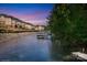 Beautiful waterfront view featuring a community boat dock, a walkway, and serene water at 126 Emerald Dr, Mooresville, NC 28117
