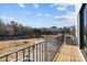 Scenic balcony view overlooking a pond and trees at 14024 Felix Ln # 4, Charlotte, NC 28277