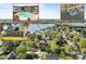 Aerial view of a lakeside community with a pool, marina, and beautiful homes at 150 Harbor Cove Ln, Mooresville, NC 28117