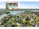 Scenic aerial view of a community pool and lakefront property, surrounded by lush greenery at 150 Harbor Cove Ln, Mooresville, NC 28117