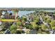 Beautiful two-story brick home with well-maintained lawn and mature trees overlooking a lake at 150 Harbor Cove Ln, Mooresville, NC 28117