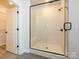 Modern bathroom featuring a glass-enclosed shower and neutral color palette at 17025 Malone Ln, Mint Hill, NC 28227