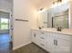 Modern bathroom featuring dual sinks, a large mirror, and a walk-in shower at 17025 Malone Ln, Mint Hill, NC 28227