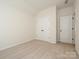 Neutral bedroom with light carpet, fresh paint, closet, and doorway at 17025 Malone Ln, Mint Hill, NC 28227