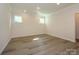 Bright bedroom with neutral walls, hardwood floors, and recessed lighting at 17025 Malone Ln, Mint Hill, NC 28227