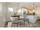 Charming dining area with a modern chandelier, open to a stylish kitchen at 17025 Malone Ln, Mint Hill, NC 28227