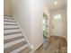 Bright entryway featuring hardwood floors, staircase and a front door with sidelights at 17025 Malone Ln, Mint Hill, NC 28227