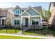 Charming home with fresh exterior paint, covered entryway, and black metal fence at 17025 Malone Ln, Mint Hill, NC 28227